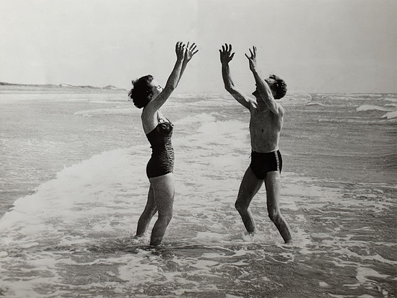 Jean and John Johnson playing in the sea c1947